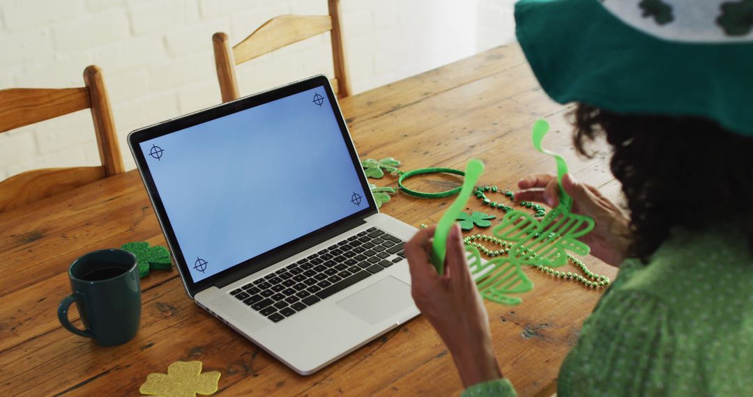 Woman Preparing St. Patrick's Day Decorations via Video Call - Free Images, Stock Photos and Pictures on Pikwizard.com