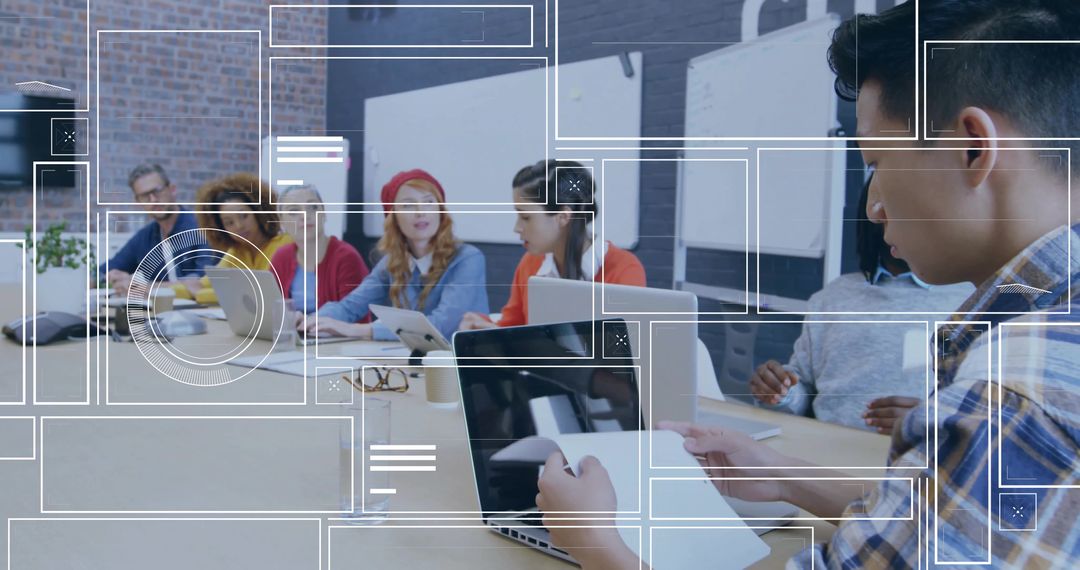 Modern Office Meeting with Diverse Team Collaborating on Laptops