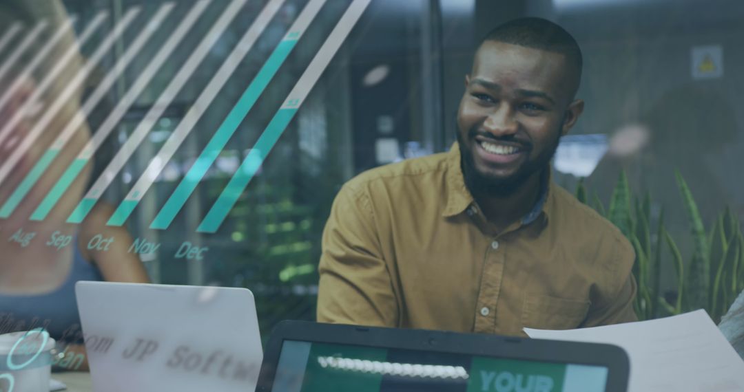 Smiling Businessman Analyzing Data with Digital Display