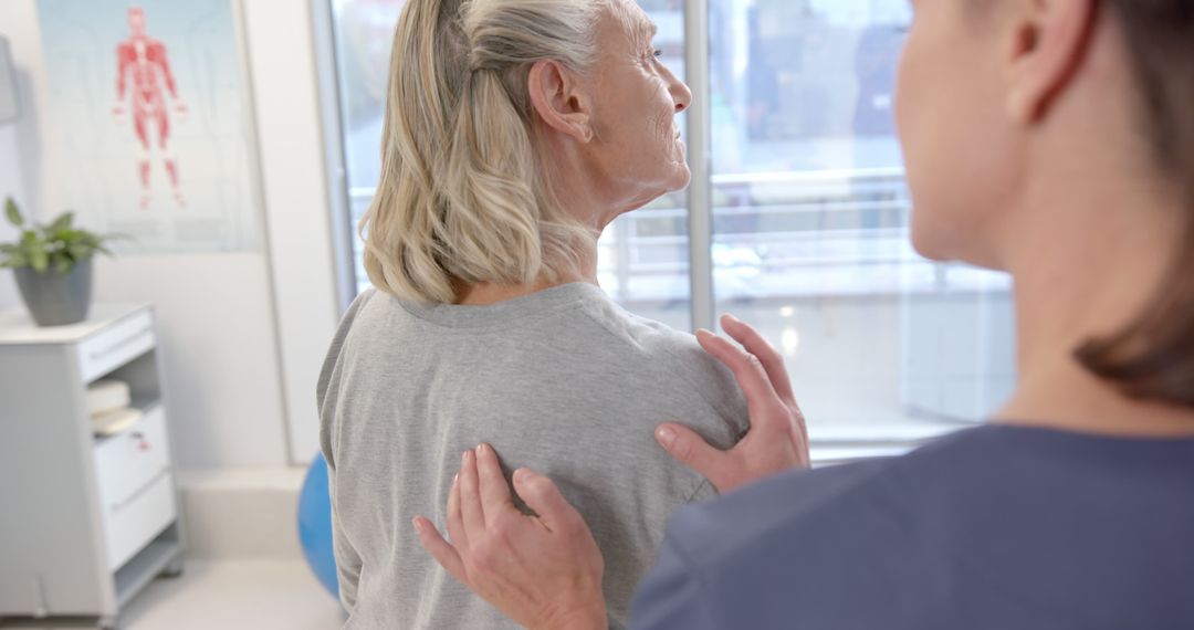 Physical therapist assisting senior woman with shoulder exercise - Free Images, Stock Photos and Pictures on Pikwizard.com