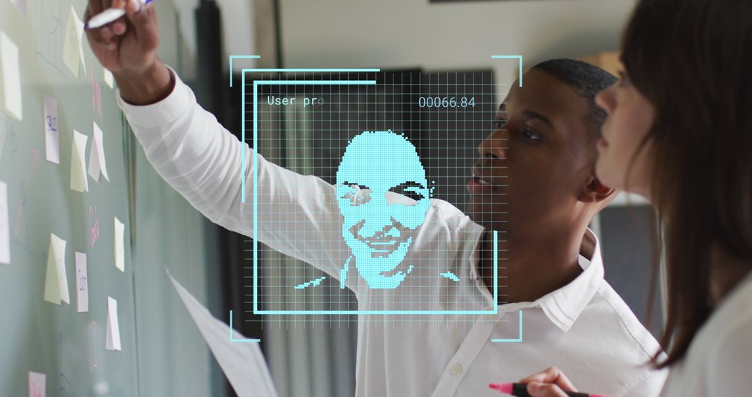Business Team Writing on Wall with Digital Face Recognition Overlay