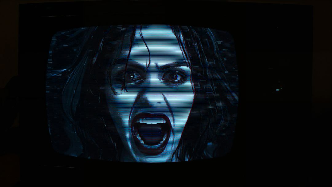 Retro CRT TV Displaying Horror Scene with Distorted Face