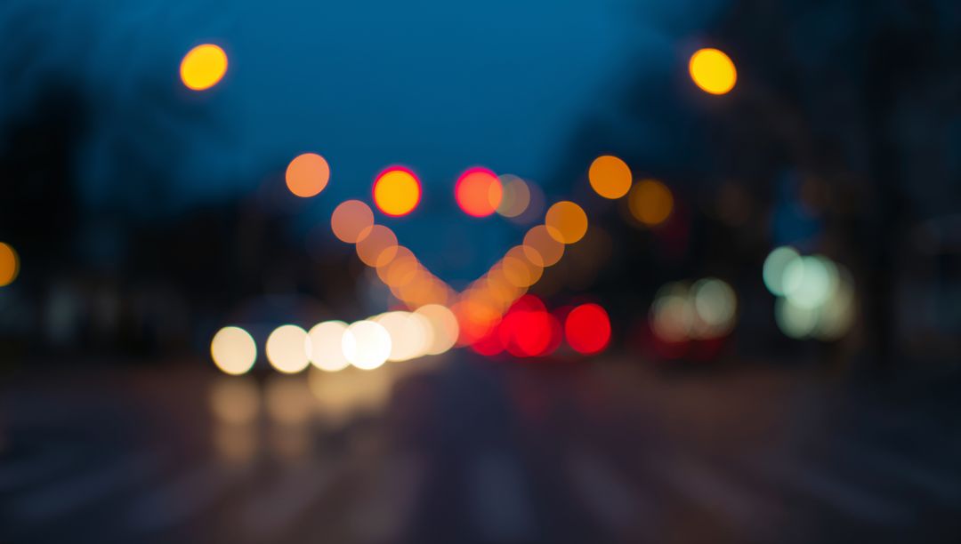 Vibrant bokeh of urban night traffic with soft lights