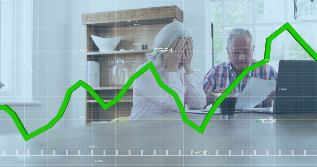 Senior Couple Analyzing Finances with Laptop and Graph Overlay