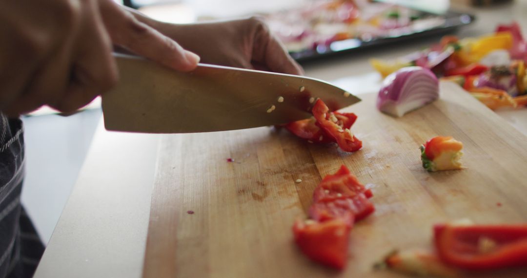 Woman Chopping Fresh Vegetables on Wooden Board - Free Images, Stock Photos and Pictures on Pikwizard.com