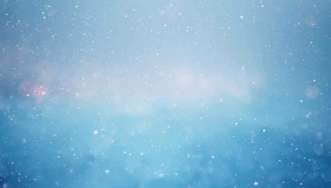 Soft Blue Winter Background with Falling Snowflakes, Bokeh and Gentle Lens Flare