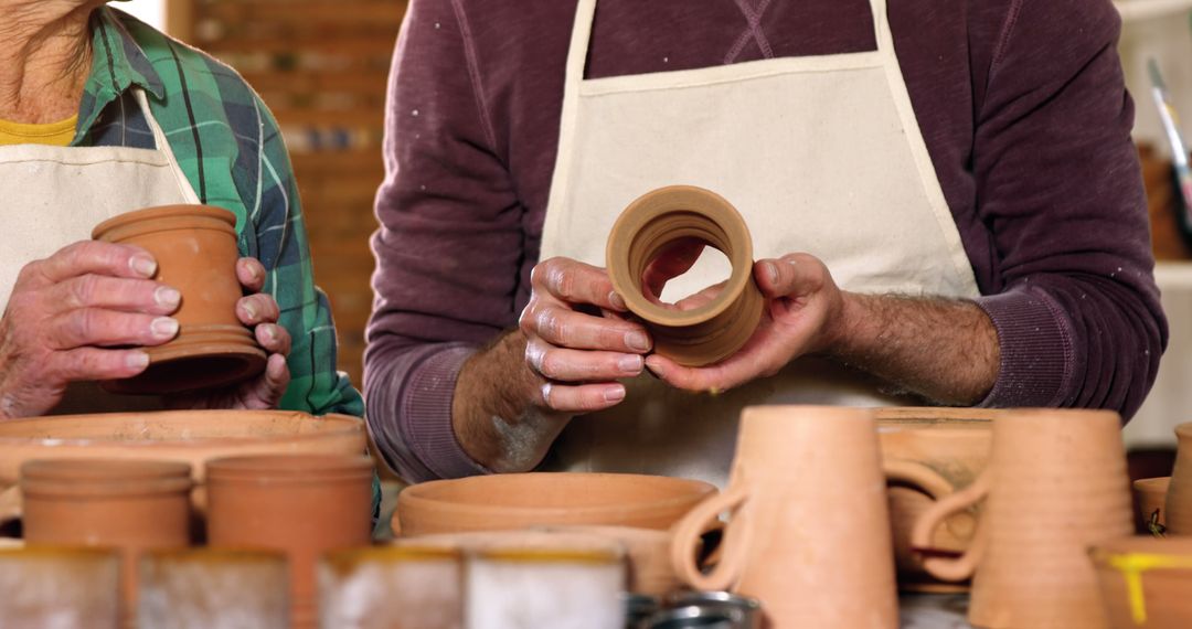 Potters Crafting Clay Pots in Workshop - Free Images, Stock Photos and Pictures on Pikwizard.com