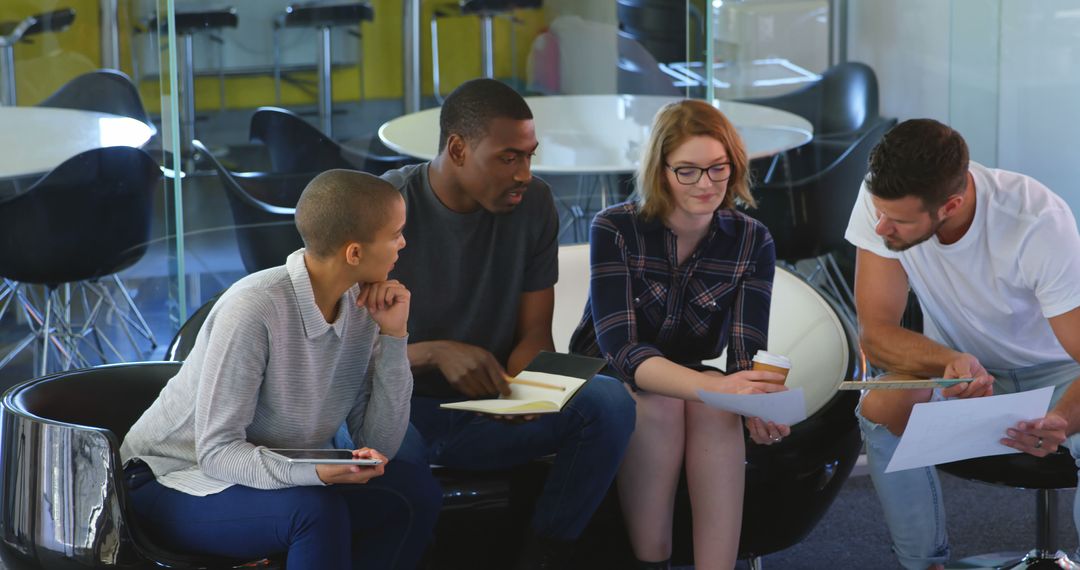 Collaborative Team Discussing Project in Modern Office