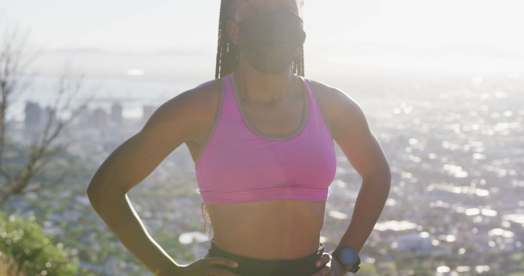 Female Athlete Wearing Mask Overlooking Cityscape - Free Images, Stock Photos and Pictures on Pikwizard.com