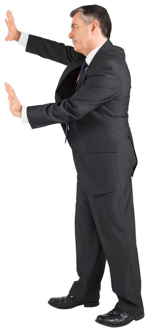 Senior Businessman Pressing Hands Against Invisible Surface Transparent