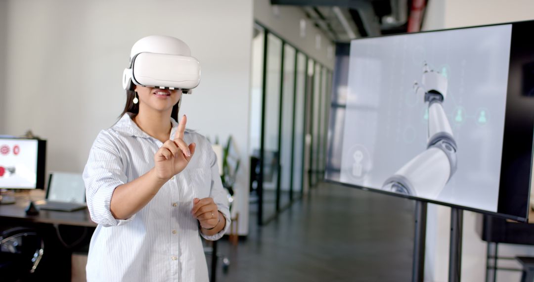 Woman Using VR Headset for Virtual Interaction in Futuristic Office