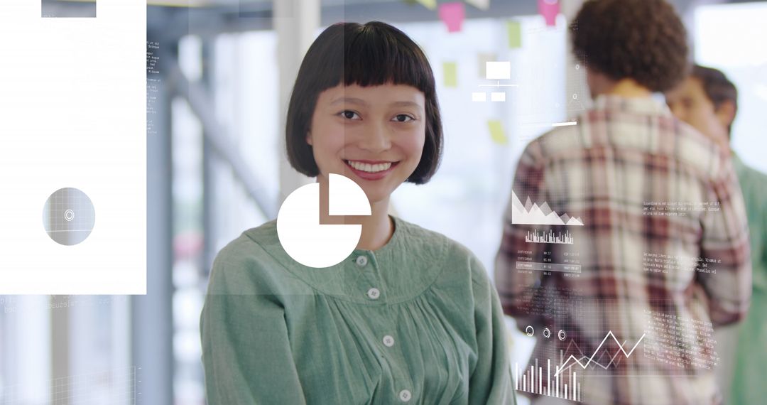 Smiling Woman in Office with Data Visualizations and Graphs