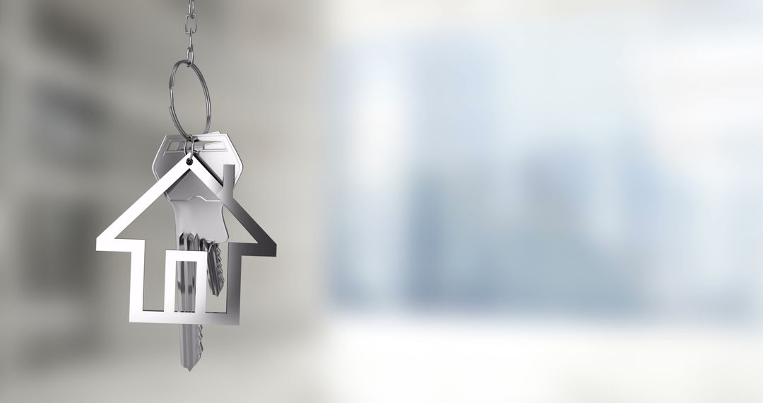 House-Shaped Keychain with Keys Over Blurred Cityscape
