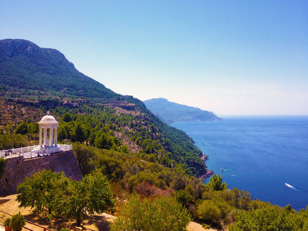 Scenic Coastal View with Mountainous Landscape and Pavilion - Free Images, Stock Photos and Pictures on Pikwizard.com