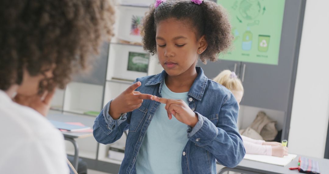 Young African American Girl Counting on Fingers in Classroom - Free Images, Stock Photos and Pictures on Pikwizard.com