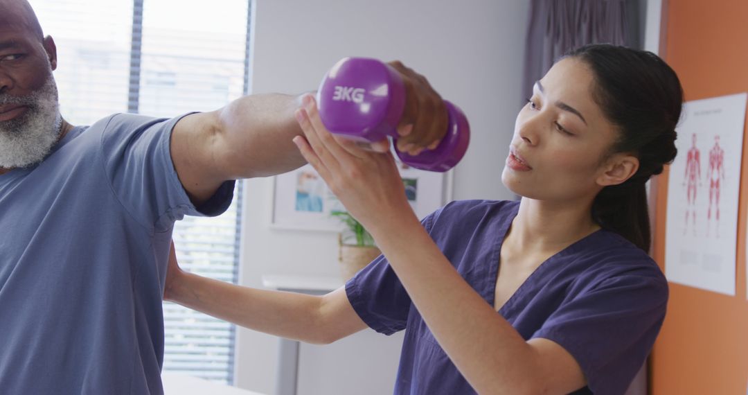 Physical Therapist Assisting Senior With Arm Exercises in Clinic - Free Images, Stock Photos and Pictures on Pikwizard.com