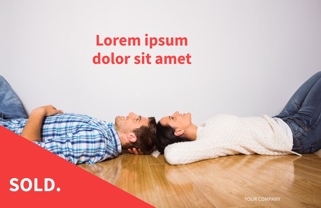 Couple lying on floor celebrating new home purchase