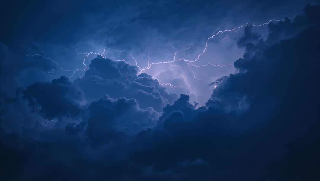 Electrifying Lightning Illuminating Thick Storm Clouds at Night