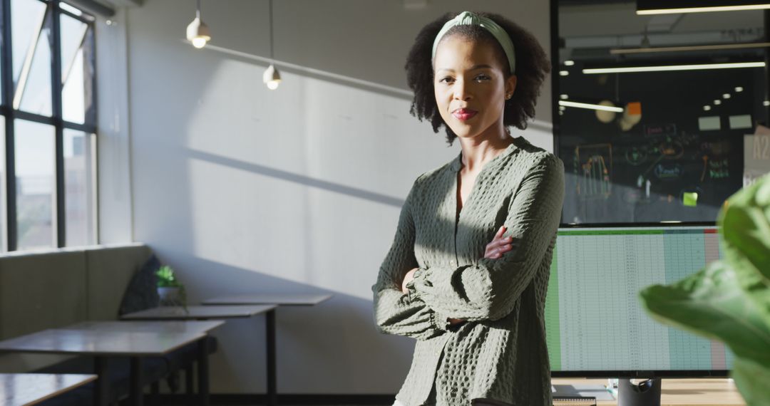 Confident African American Businesswoman in Sunlit Office - Free Images, Stock Photos and Pictures on Pikwizard.com