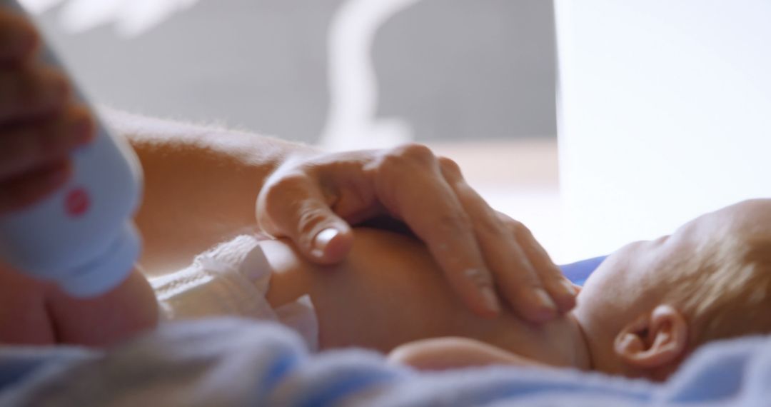 Close-up of Parent Applying Baby Lotion to Infant's Skin - Free Images, Stock Photos and Pictures on Pikwizard.com