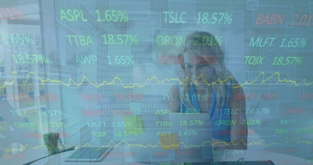 Financial Data Overlay on Focused Businesswoman Working