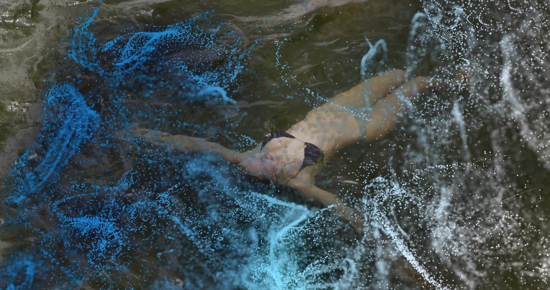 Serene Woman Floating in Water with Digital Particle Effects