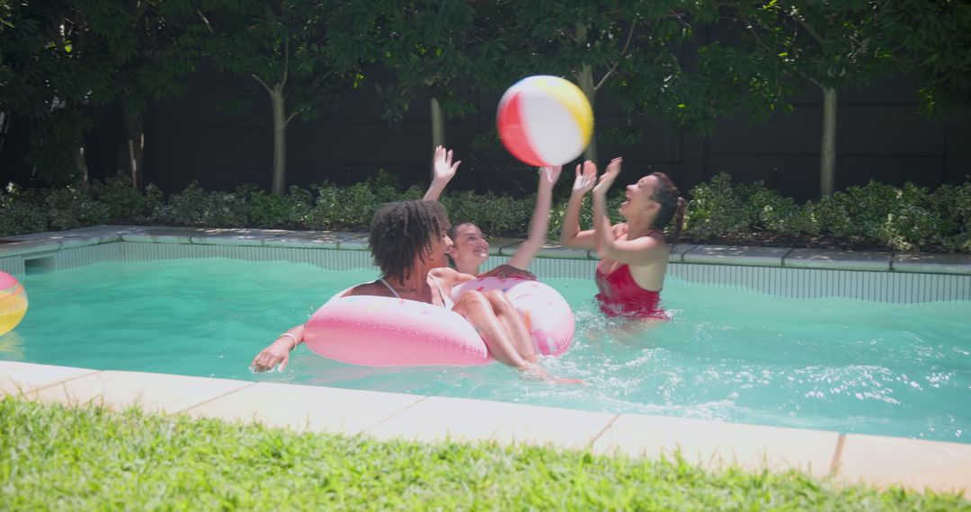 Diverse Female Friends Enjoying a Lively Poolside Game