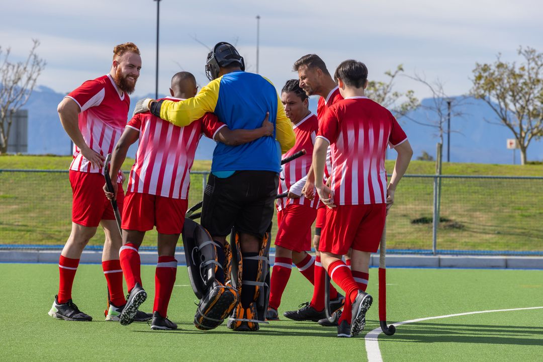 Field Hockey Players Huddling in Team Unity Outdoors