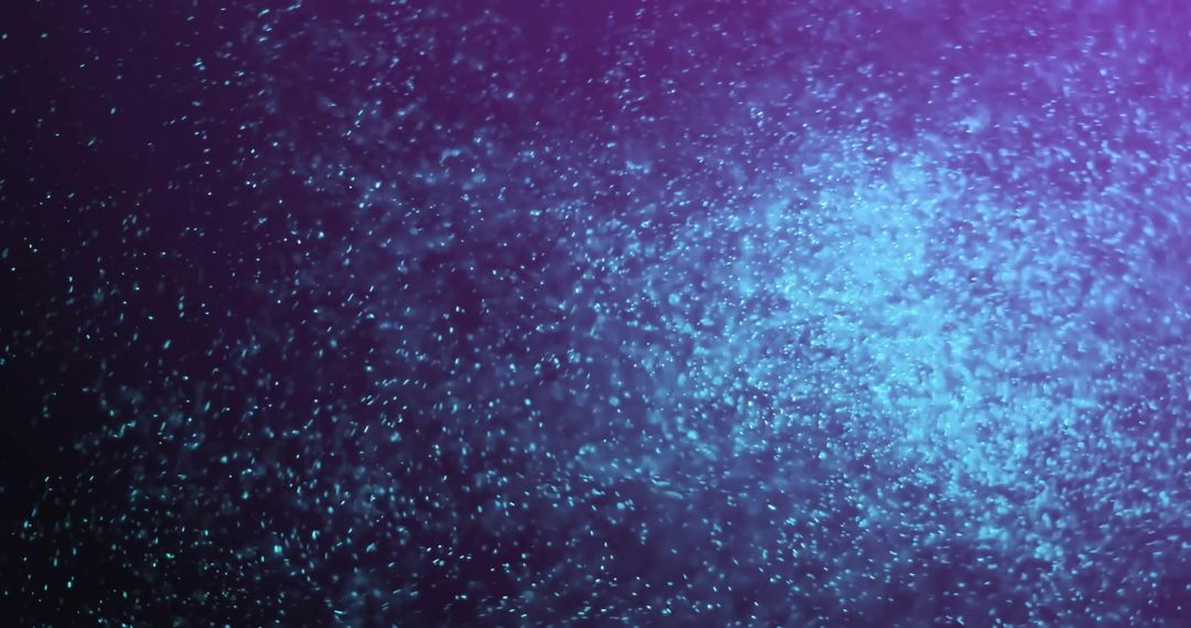 Abstract Glowing Particles in Motion Over Dark Background