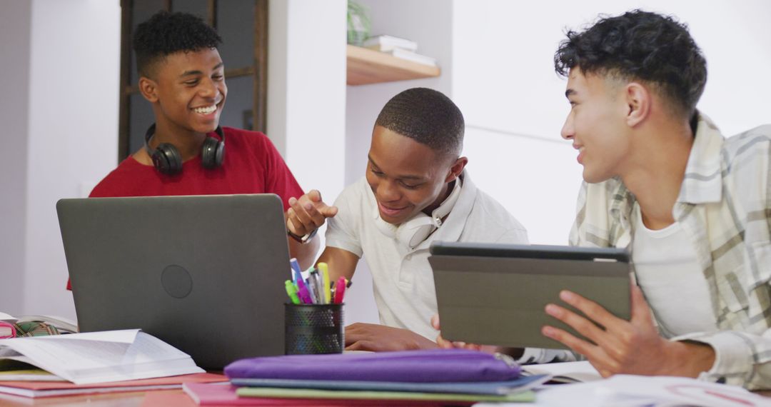 Diverse Teenage Boys Studying Together with Laptops and Tablets - Free Images, Stock Photos and Pictures on Pikwizard.com