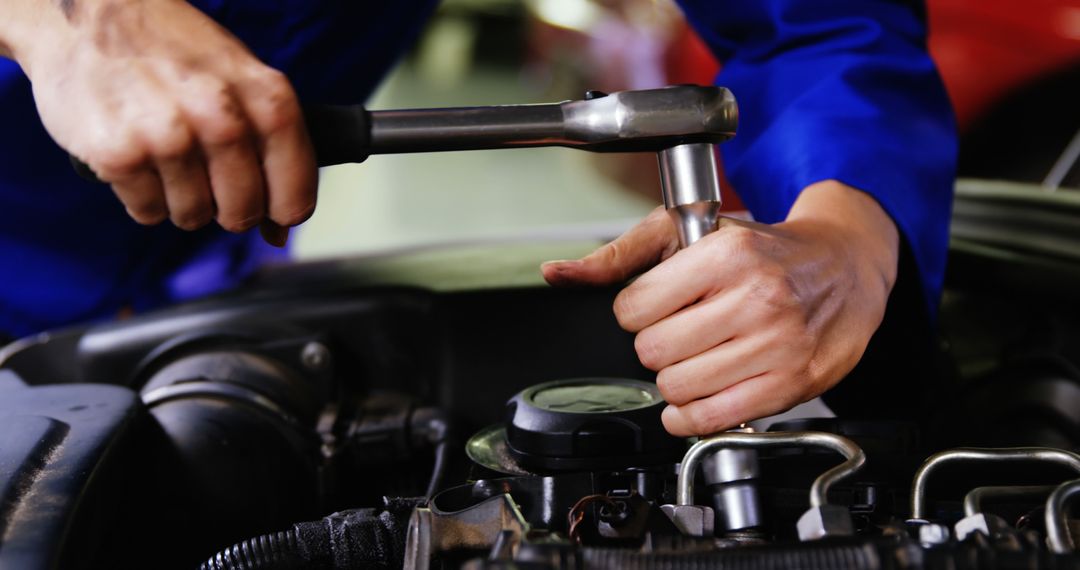 Automotive Mechanic Working on Car Engine With Wrench - Free Images, Stock Photos and Pictures on Pikwizard.com