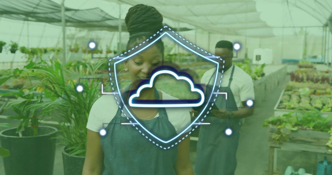 Greenhouse workers using smartphone with cloud shield overlay for smart nursery management