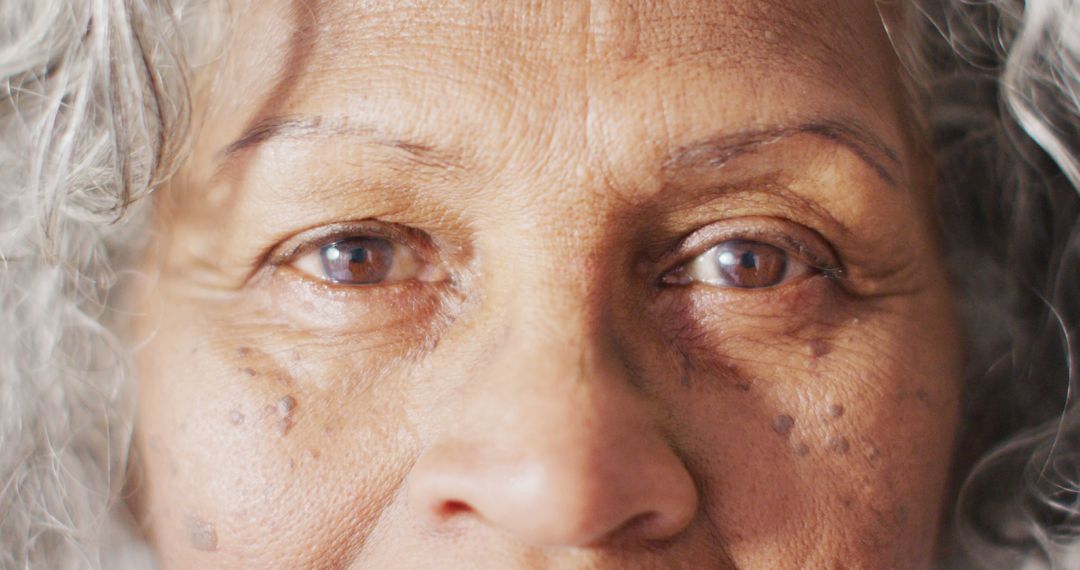 Close-up of Elderly Woman's Eyes with Grey Hair - Free Images, Stock Photos and Pictures on Pikwizard.com