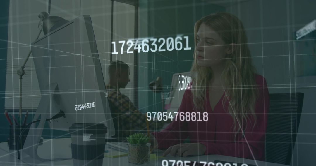 Focused Businesswoman Analyzing Data on Office Computer