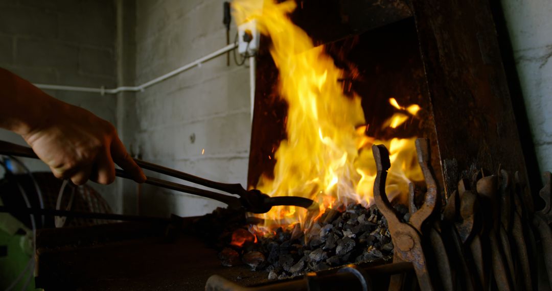 Close Up of Hands at Forge Heating Horseshoe