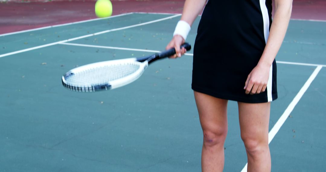 Woman Holding Tennis Racket on Court While Training - Free Images, Stock Photos and Pictures on Pikwizard.com