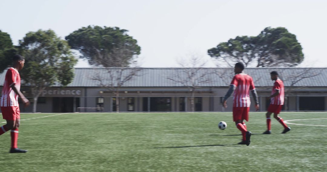 Youth Soccer Team Practicing Teamwork on School Field