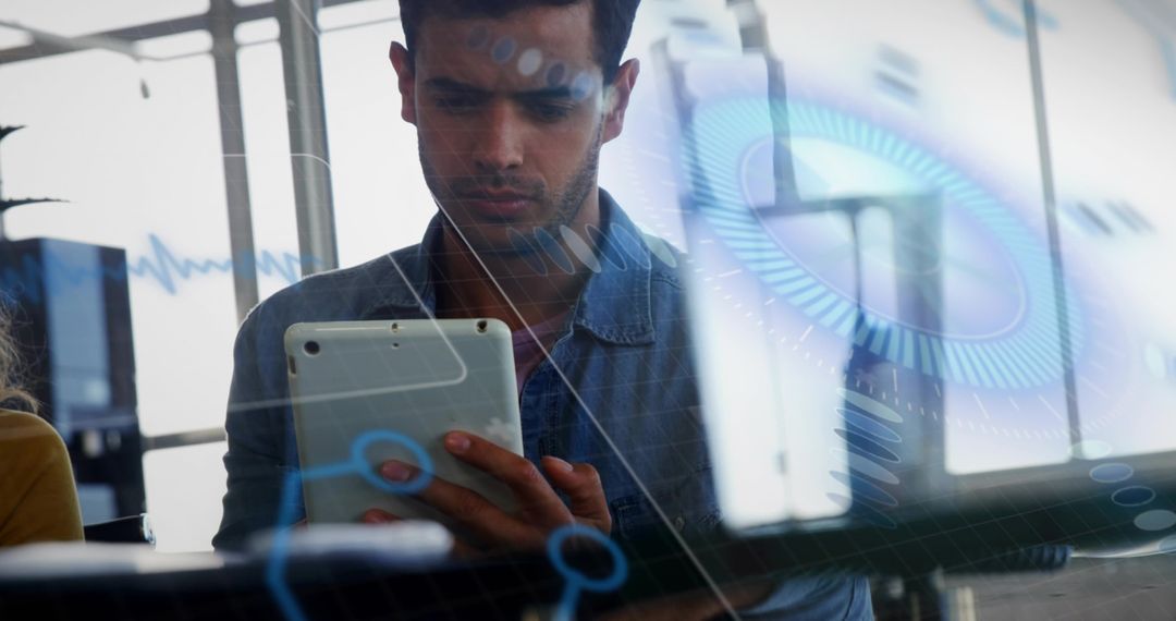 Man Examining Tablet with Holographic Tools in Office Setting