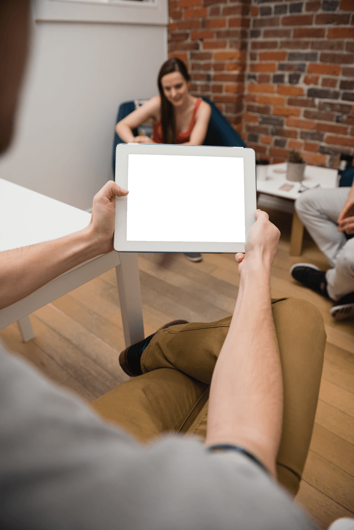 Tablet with Transparent Screen Held in Creative Office