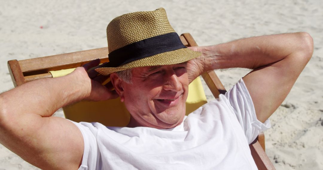 Senior Man Enjoying Summer Relaxation on Sandy Beach