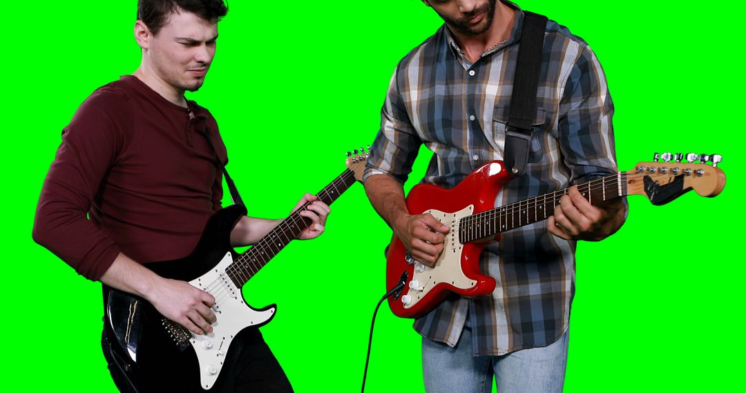 Male musicians playing guitar against green screen - Free Images, Stock Photos and Pictures on Pikwizard.com