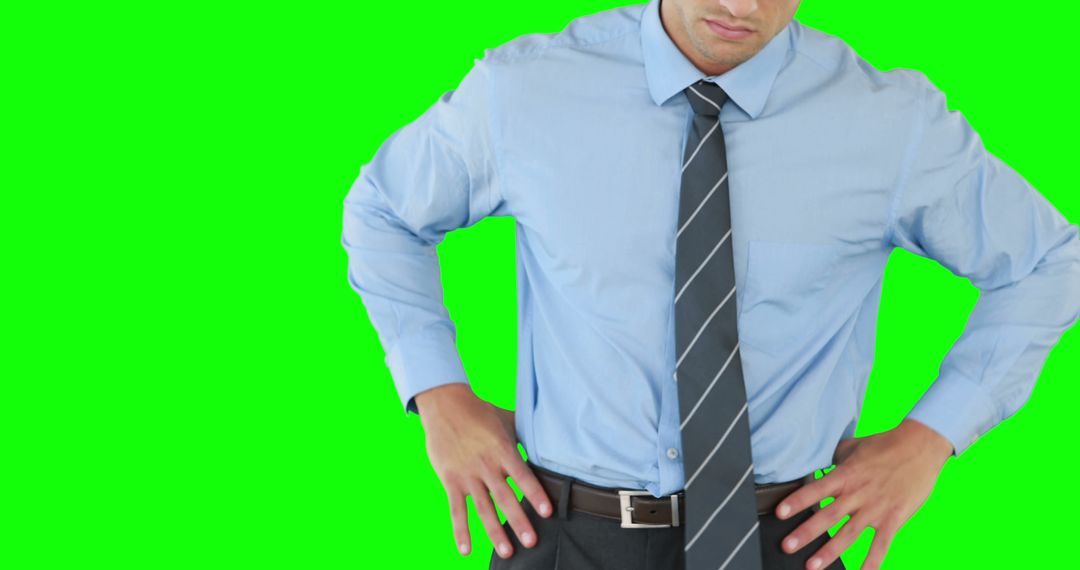 Confident Businessman in Professional Attire with Green Screen