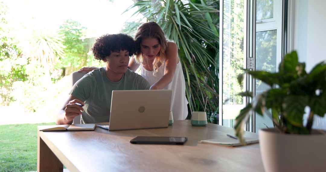 Young Couple Collaborating Remotely at Home