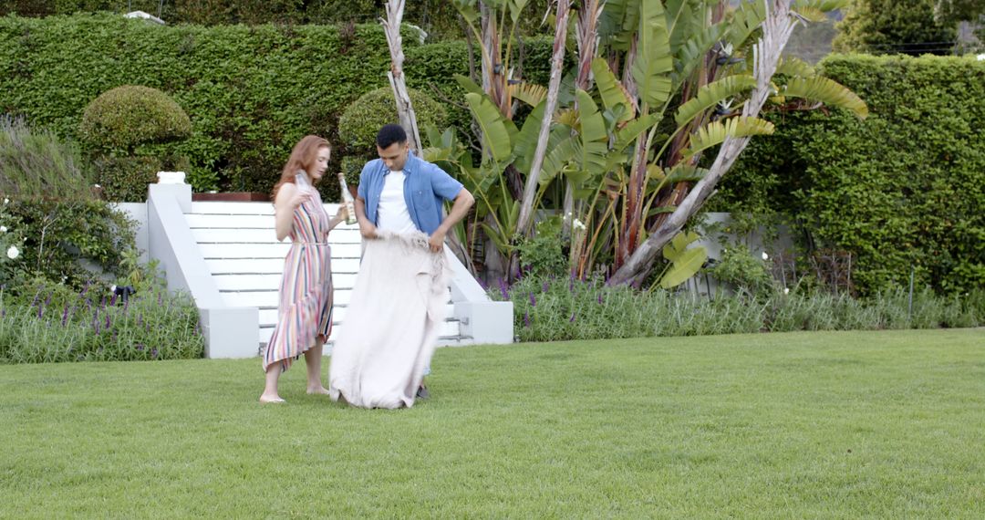 Man Proposing to Partner in Sunny Garden with Embrace and Laughter