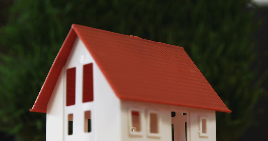 Miniature White Scale House Featuring Red Roof Closeup Macro with Bokeh Background
