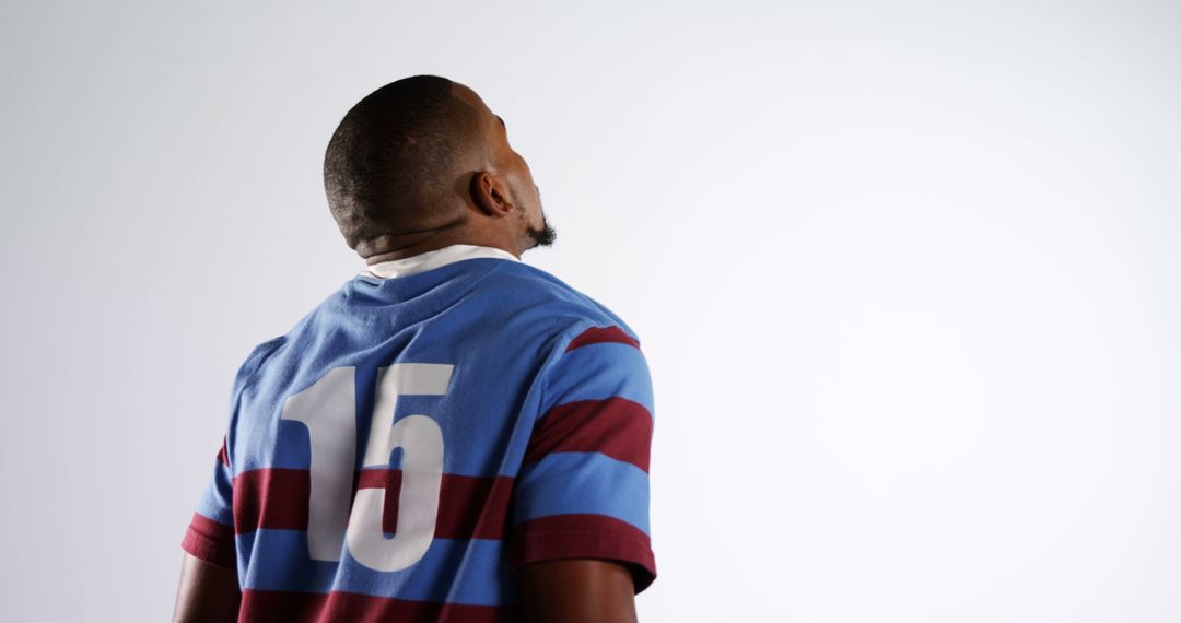 Rugby Player Wearing Striped Jersey with Number 15 on Back - Free Images, Stock Photos and Pictures on Pikwizard.com