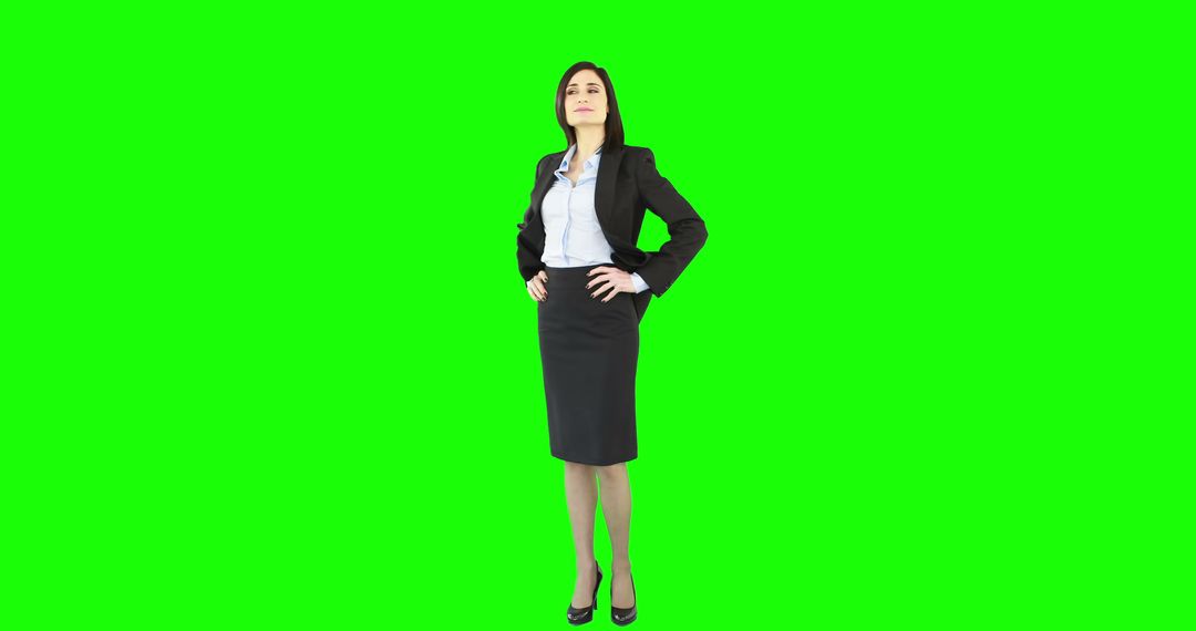 Confident Businesswoman in Suit Standing on Green Screen - Free Images, Stock Photos and Pictures on Pikwizard.com