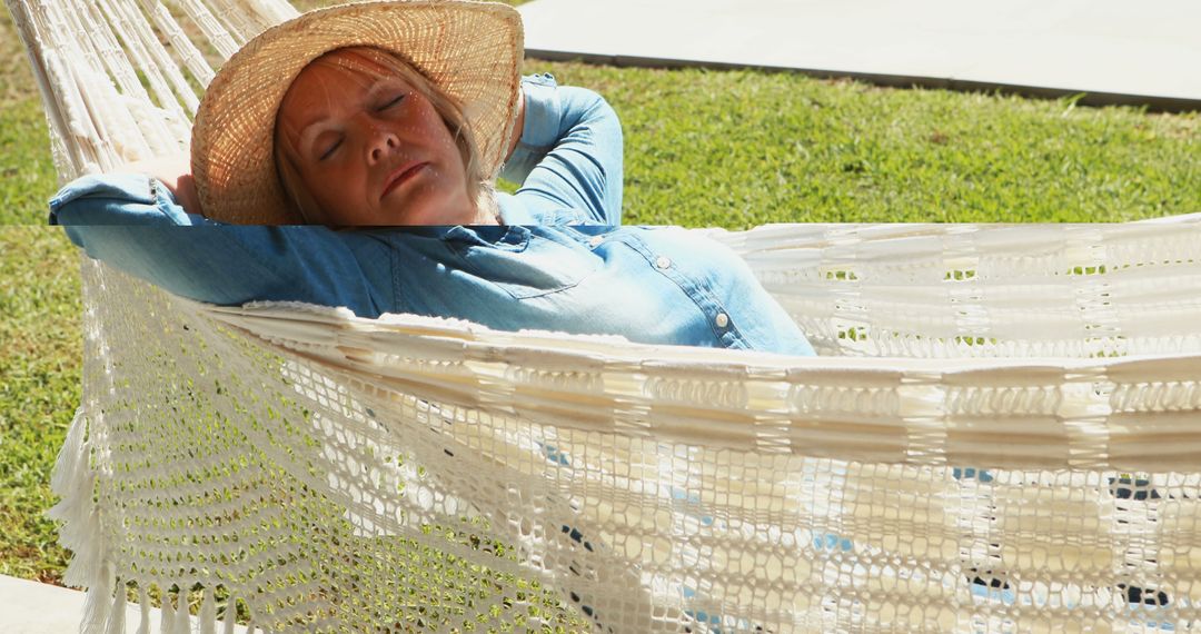 Senior Woman Relaxing in Hammock Wearing Sun Hat - Free Images, Stock Photos and Pictures on Pikwizard.com
