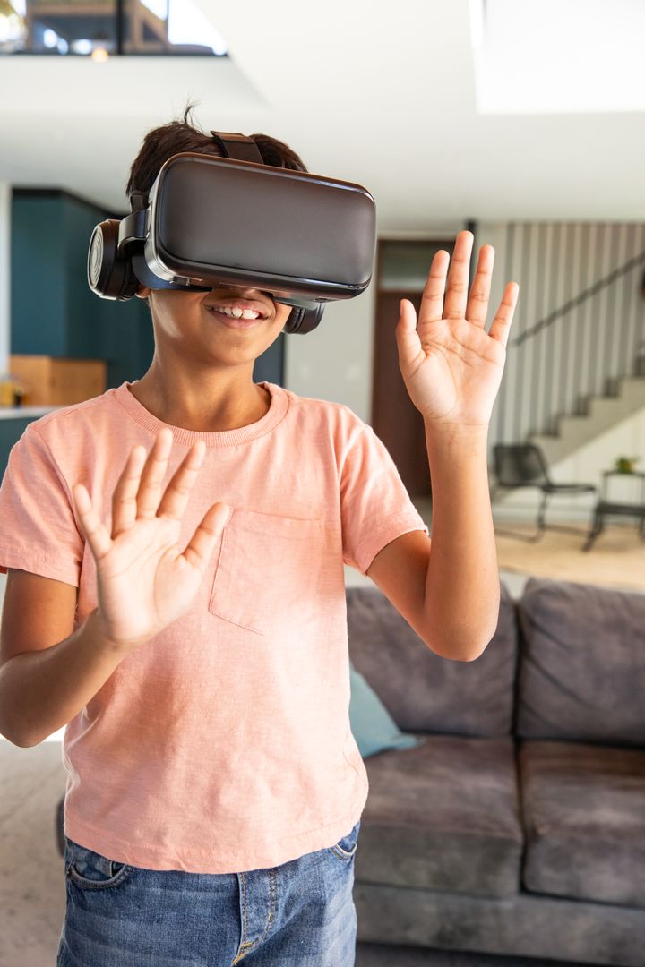 Enthusiastic Boy Engaging with Virtual Reality Technology Indoors