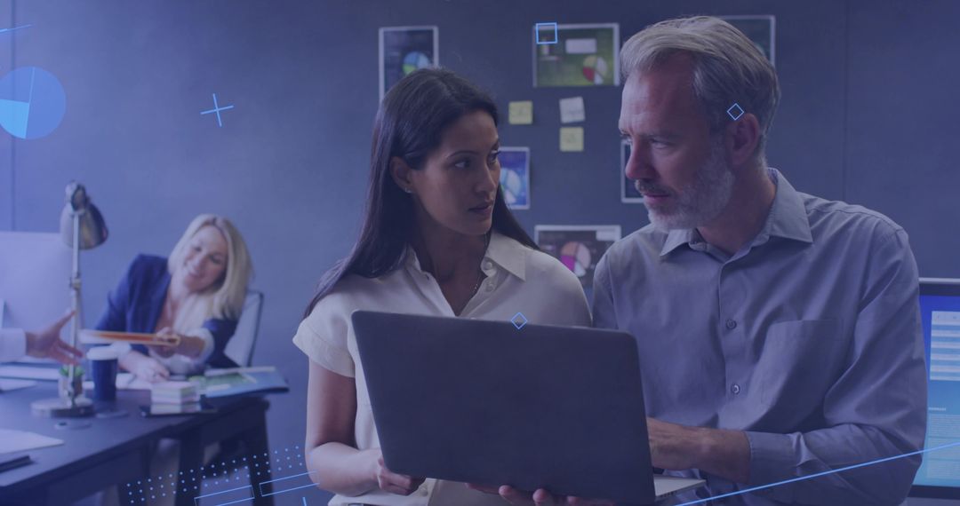 Reviewing Project on Laptop, Collaborating Colleagues in Open Office with Sticky Notes